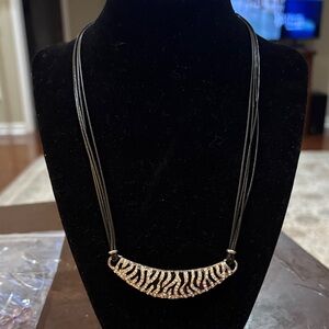 Black Cord Necklace with Zebra-Patterned Gold Pendant